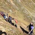 ITEX members hike along a narrow ridge.